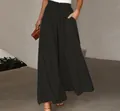 Detail of high-waisted black wide-leg pants with comfortable elastic waistband - Black