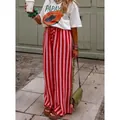 Pantalones anchos con rayas rojas y rosas para un look veraniego relajado y elegante de calle. - S / Bottoms / Rojo