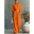 Elegant orange V-neck wide-leg jumpsuit with cinched waist design for a sophisticated look - S / Jumpsuits / Orange