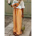 Pantalones anchos y casuales para mujer con rayas verticales naranjas y blancas. - S / Bottoms / Naranja