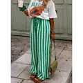 Pantaloni larghi casual a righe verticali verdi e bianche a vita alta da donna per l'estate. - Verde