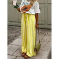 Eleganti pantaloni larghi a righe verticali gialle e bianche per donna estivi - giallo fluorescente