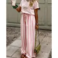 Pantaloni casual da donna a vita alta con strisce verticali rosa e bianche a gamba larga. - Rosa