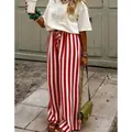 Eleganti pantaloni a gamba larga a righe verticali rosse e bianche per look casual chic - rosso mattone
