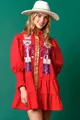 Close-up of a red Christmas dress featuring sequin nutcracker embroidery and long sleeves - S / Dresses / Red