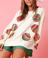 Détail d'un sweat-shirt crème avec broderie festive de boules de Noël en paillettes - S / Hauts / Blanc