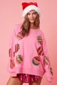 Détail du sweat-shirt de Noël rose avec broderie de paillettes colorées en forme d'ornements - S / Hauts / Rose