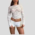 Close-up of intricate white floral lace texture on a sheer long-sleeve round neck top - S / Tops / White Flower