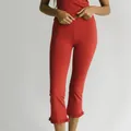 Minimalist red ribbed knit cropped pants with feminine ruffle hem detail for casual summer wear - S / Bottoms / Red