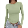 Close-up of a women's slim-fit sage green long-sleeved T-shirt with a round neck. - Matcha Green