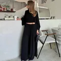 Elegante set nero a 3 pezzi con cardigan lungo, crop top e pantaloni a gamba larga da donna. - Taglia S / Top E Pantaloni / Nero