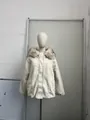 Detail view of cream-colored hooded winter coat with plush fur collar on mannequin - S / Tops / Oatmeal