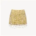 Detailed close-up view of yellow sequin mini skirt with sparkling silver fringe accents - S / Bottoms / Yellow