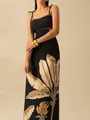 Detailed view of the black resort maxi dress featuring a waist cutout and leaf print - S / Dresses / Black Cut-Out Backless Slip Dress