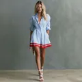 Full body view of a blue striped shirt dress with cinched waist and red hem trim. - XS / Dresses / Blue Striped Color Block
