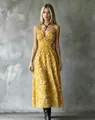 Detailed front view of a yellow floral V-neck maxi dress with a slimming waist design. - XS / Dresses / Yellow