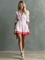 Detailed view of women's pink striped shirt dress with a cinched waist and red hem - Light Pink Striped Color Block