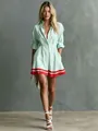 Detailed view of striped shirt dress featuring a red contrasting hem and cinched waist. - Mint Green Striped Color Block
