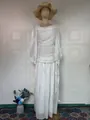 Detailed texture of elegant white long-sleeved maxi dress with ruched design - S / Dresses / White
