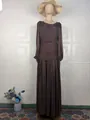 Detailed view of an elegant brown pleated maxi dress with long sleeves on a mannequin. - S / Dresses / Coffee