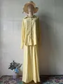 Elegant yellow two-piece set featuring long sleeve button shirt and matching maxi skirt. - Top And Bottom / Light Yellow / S