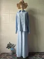 Elegant light blue long-sleeved shirt and maxi skirt set on mannequin - Top And Bottom / Light Blue / S