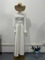 Elegant white long-sleeved maxi dress with waist wrap and puff sleeves on mannequin. - S / Dresses / White
