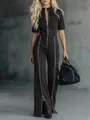 Full-length view of a slim fit black denim jumpsuit with multiple zipper accents. - 3XL / Jumpsuits / Black