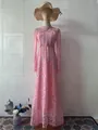 Detailed view of elegant pink Victorian lace long-sleeved maxi dress on mannequin - S / Dresses / Pink