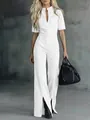 Detailed view of a white slim-fit denim jumpsuit with short sleeves and wide legs. - 3XL / Jumpsuits / White