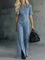 Detailed shot of a stylish light blue denim jumpsuit featuring unique zipper accents - 3XL / Jumpsuits / Light Blue