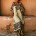 Detailed view of women's bohemian printed loose maxi dress with ethnic patterns - S / Dresses / Green