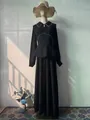 Elegant black long-sleeved peplum maxi dress with rhinestone trim on a mannequin - S / Dresses / Black