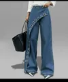 Detail of high waist wide-leg denim pants featuring diagonal metal eyelet design - S / Bottoms / Blue