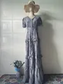 Elegant vintage floral maxi dress with short sleeves and ruffled layers on a mannequin - S / Dresses / Light Gray