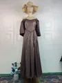 Elegant chocolate brown satin evening gown with off-the-shoulder design on a mannequin - S / Dresses / Champagne Gold