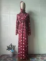 Full view of an elegant floral maxi dress displayed on a mannequin in a bright room - S / Set / Red