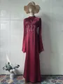 Elegant burgundy long-sleeved maxi dress with corset waist detail on mannequin display - S / Dresses / Red