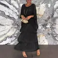 Elegant black tiered maxi dress with loose fit and stylish gold clutch accessory - S / Top And Bottom / Black