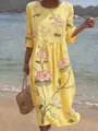 Close-up detail of the vibrant lotus flower embroidery on this yellow midi summer dress - S / Dresses / Yellow Lotus Print (Y-14)