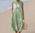 Detailed view of the sleeveless green maxi dress featuring a fresh white floral pattern. - 4XL / Dresses / Multi-color 2