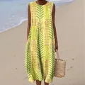 Detailed view of yellow sleeveless maxi dress with botanical floral print on beach - 4XL / Dresses / Yellow Floral Cluster (Pattern 11)