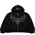 Detail of a black zip-up hoodie featuring a white bat graphic and hood text - S / Tops / Black