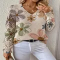 Detail of the V-neck sweater showing the floral print and crochet hollow-out sleeves - S / Tops / Color 5