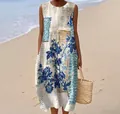 Elegant detail view of a sleeveless blue floral print maxi dress with a beach background - 4XL / Dresses / Pattern 24