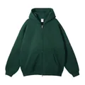 Vooraanzicht detail van een donkergroene oversized hoodie met rits en zakken - XS / Tops / Groen