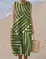 Close-up of sleeveless green maxi dress with white geometric pattern on beach - 4XL / Dresses / Green Geometric Stripe Print (Pattern 31)