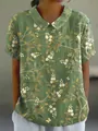 Detailed macro view of women's loose floral print top with a classic turnover collar - S / Tops / Dark Green White Floral (Pattern 20)