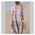 Full-body view of a bohemian floral maxi dress modeled on a sunny beach background - S / Dresses / Pattern 5