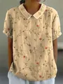 Close-up of vintage floral print and lapel collar on beige linen short sleeve shirt - S / Tops / Beige (Red and Yellow Floral Print)